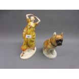 Czechoslovakian pottery figure of a girl dancer together with a Russian figure of a seated dog