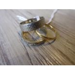 22ct Gold wedding band, a 9ct white gold wedding band and a 9ct yellow gold eternity ring