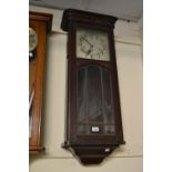 Early 20th Century Continental carved and stained rectangular Vienna type wall clock, the silvered