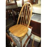 Pair of Ercol pale beech and ash stick back dining chairs (one at fault)