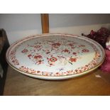 Large 19th Century pottery Lazy Susan, decorated in iron red and black with a floral design