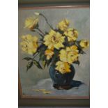 Mid 20th Century oil on canvas, yellow flowers in a pottery vase on a table, indistinctly signed,