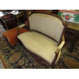 Late 19th Century French carved walnut and upholstered drawing room sofa raised on turned tapering