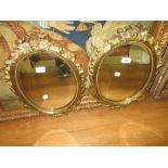 Pair of 19th Century oval gilt brass bevelled edge wall mirrors 18.5ins high x 13ins wide Some