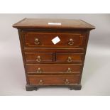 19th Century miniature mahogany and inlaid chest with a fitted secretaire drawer above two short and