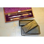 Continental silver four piece cutlery set in fitted case, a three piece horn handled carving set and