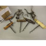 19th Century corkscrew with ivory handle and brush, similar rosewood corkscrew and a collection of