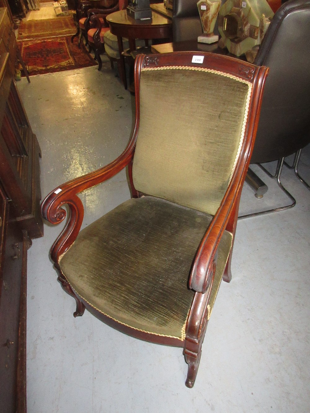 Pair of 19th Century French mahogany green upholstered open armchairs with scroll arms and front