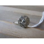 Art Deco style octagonal diamond set ring with a central stone surrounded by eight further smaller