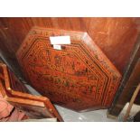 Early 20th Century Burmese lacquer octagonal occasional table, the top decorated with figures and