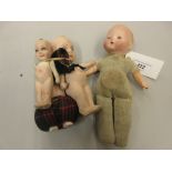 Small German bisque headed baby doll with cloth body together with two other bisque dolls and a