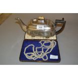 19th Century silver plate on copper teapot with boxwood handle, together with a long glass bead