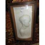 Late 19th / early 20th Century plaster plaque, profile portrait of a young saint, in an oak glazed