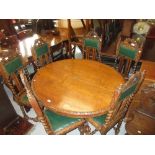 19th Century Continental carved oak oval pedestal dining table with carved rim on heavy turned