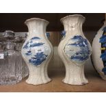 Pair of 19th Century Chinese crackleware baluster form vases painted with panels of landscapes in