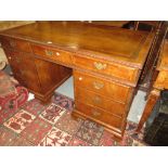 Early 20th Century burr walnut twin pedestal desk in early 18th Century style, having brown