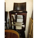 Nineteen matching simulated brown leather upholstered bar stools with square tapering supports and