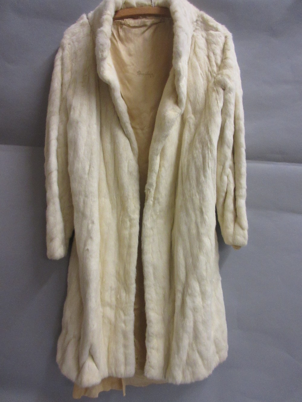 Ladies white ermine three quarter length fur coat (at fault)