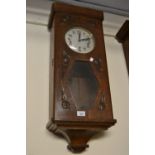 Early 20th Century Continental oak cased rectangular wall clock with carved decoration of roses, the