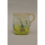 Daum Nancy cameo glass miniature jug of oval form, carved in shallow relief with trailing flowers,