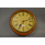 Early 20th Century oak cased wall clock having brass bezel with 11.5in paper dial with Roman