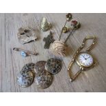 Small bag containing a ladies gold plated wristwatch, various tie pins, buttons etc