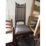Set of four Continental oak Arts and Crafts slat back dining chairs with upholstered seats, raised