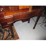 Georgian style mahogany serpentine fronted fold-over card table with baize lined interior, on square