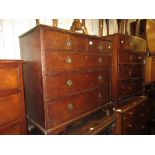 Late George III oak straight front chest of two short over three long drawers with brass ring