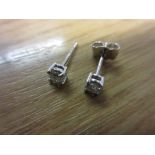 Pair of 18ct white gold diamond ear studs (approximately 0.30ct total) one butterfly missing