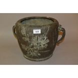 Japanese brown patinated bronze two handled jardiniere relief moulded with chrysanthemum