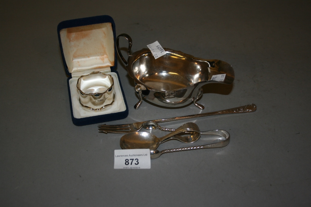 Silver cream jug, silver napkin ring, babies spoon, sugar tongs and pickle fork