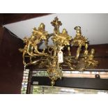 Late 19th or early 20th Century gilt brass twelve light chandelier adapted for use with electricity,