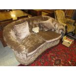 Newly upholstered kidney shaped two seat sofa with a buttoned grey velvet type upholstery