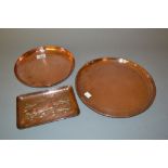 Newlyn copper circular dish, 11ins diameter, together with another decorated with a fish, 9ins