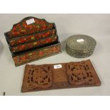 Indian carved hardwood sliding book rack, a Kashmiri letter rack and an oval cast metal casket