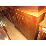 19th Century mahogany two door bookcase with a shelved and divided interior measures 49in wide x