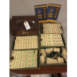 Early 20th Century leather cased bamboo and bone Mahjong set, with original instruction booklets,