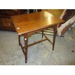 Two rectangular walnut Arts and Crafts occasional tables with ring turned supports and stretchers