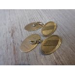 Pair of oval 9ct gold cufflinks engraved with key pattern 5g