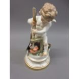 19th Century Meisen figure of a cherub with hearts in a press, 7.5ins high