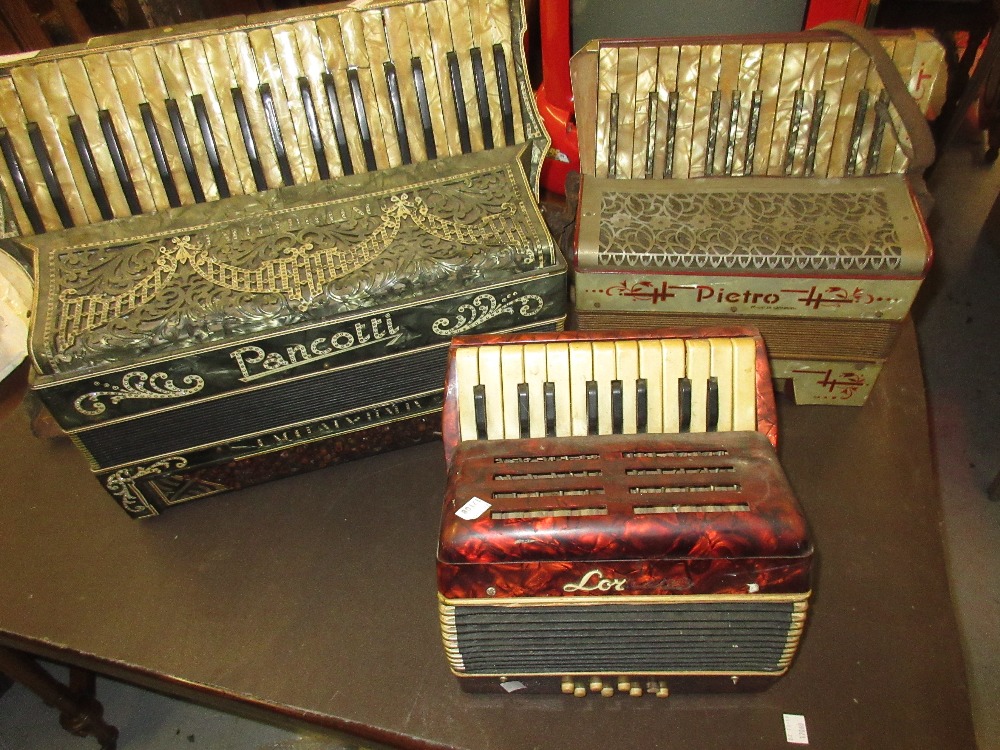 Three various piano accordions (at fault)