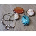 Two cameo brooches, turquoise pendant, an agate brooch and a silver bracelet