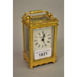 Small French brass cased carriage clock, the enamel dial with Roman numerals, signed Angora Watch