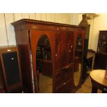 Edwardian mahogany and satinwood crossbanded triple section wardrobe, the moulded cornice above a