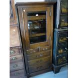 The Harvard Co., Canton, Ohio, 20th Century oak dentist's cabinet with a glazed door enclosing