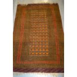 Pakistan rug of Turkoman design on a rust ground, 38ins x 58ins