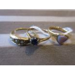 Three various yellow metal dress rings