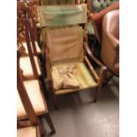 20th Century beechwood folding campaign chair with canvas back and seat and leather strap work arms,