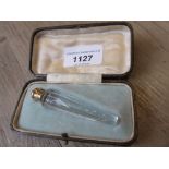 Miniature faceted tapering crystal and high carat gold screw top scent bottle in a later fitted box